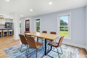 Dining - Newly remodeled 5BR farmhouse in Coloma, just 8 minutes to Lake Michigan beach. Enjoy 3,000 sq ft, 2 full baths, smart TVs in every bedroom, a covered deck, large yard, and private balcony off the primary suite. (Coloma)