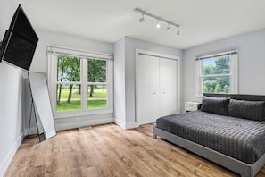 Room - Newly remodeled 5BR farmhouse in Coloma, just 8 minutes to Lake Michigan beach. Enjoy 3,000 sq ft, 2 full baths, smart TVs in every bedroom, a covered deck, large yard, and private balcony off the primary suite. (Coloma)