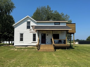 Exterior - Newly remodeled 5BR farmhouse in Coloma, just 8 minutes to Lake Michigan beach. Enjoy 3,000 sq ft, 2 full baths, smart TVs in every bedroom, a covered deck, large yard, and private balcony off the primary suite. (Coloma)