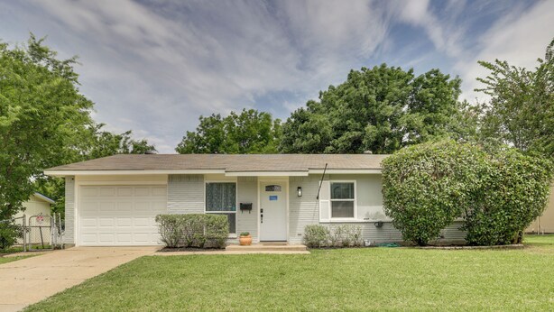 A single-story house with a garage, a front porch, and a well-maintained lawn. - 4 Mi to Dtwn: Garland Getaway w/ Fenced-in Yard (Garland)