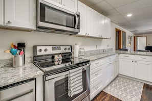 A kitchen with white cabinets, a microwave, a stove, and a dishwasher. - 8 Mi to Nat'l Military Park: Rural Pea Ridge Base (Pea Ridge)