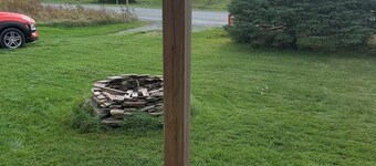 Escape to The Blue Bird – a cozy 2-bedroom cottage with hot tub and partial ocean views! Just 5 mins from Carbonear & 15 mins to Salmon Cove Sands.