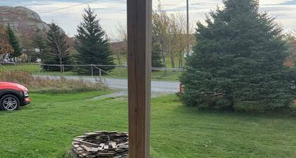 Escape to The Blue Bird – a cozy 2-bedroom cottage with hot tub and partial ocean views! Just 5 mins from Carbonear & 15 mins to Salmon Cove Sands.