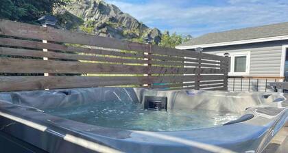 Escape to The Blue Bird – a cozy 2-bedroom cottage with hot tub and partial ocean views! Just 5 mins from Carbonear & 15 mins to Salmon Cove Sands.