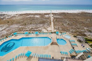 A resort with a large pool area, multiple swimming pools, and a beach view. - Phoenix Vii 7808 3 Bedroom Condo (Orange Beach)