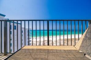 A balcony with a view of a beach and ocean. - Phoenix Viii 81206 3 Bedroom Condo (Orange Beach)