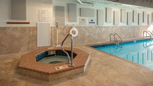 A swimming pool with a hot tub, a lifebuoy, and a caution sign. - Phoenix Viii 81103 3 Bedroom Condo (Orange Beach)