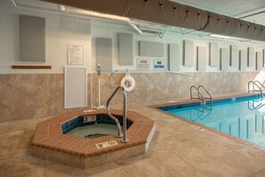 A swimming pool with a hot tub, a lifebuoy, and a caution sign. - Phoenix Viii 81103 3 Bedroom Condo (Orange Beach)