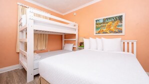 A room with a bunk bed, a single bed, and a painting on the wall. - Phoenix Vii 71205 3 Bedroom Condo (Orange Beach)