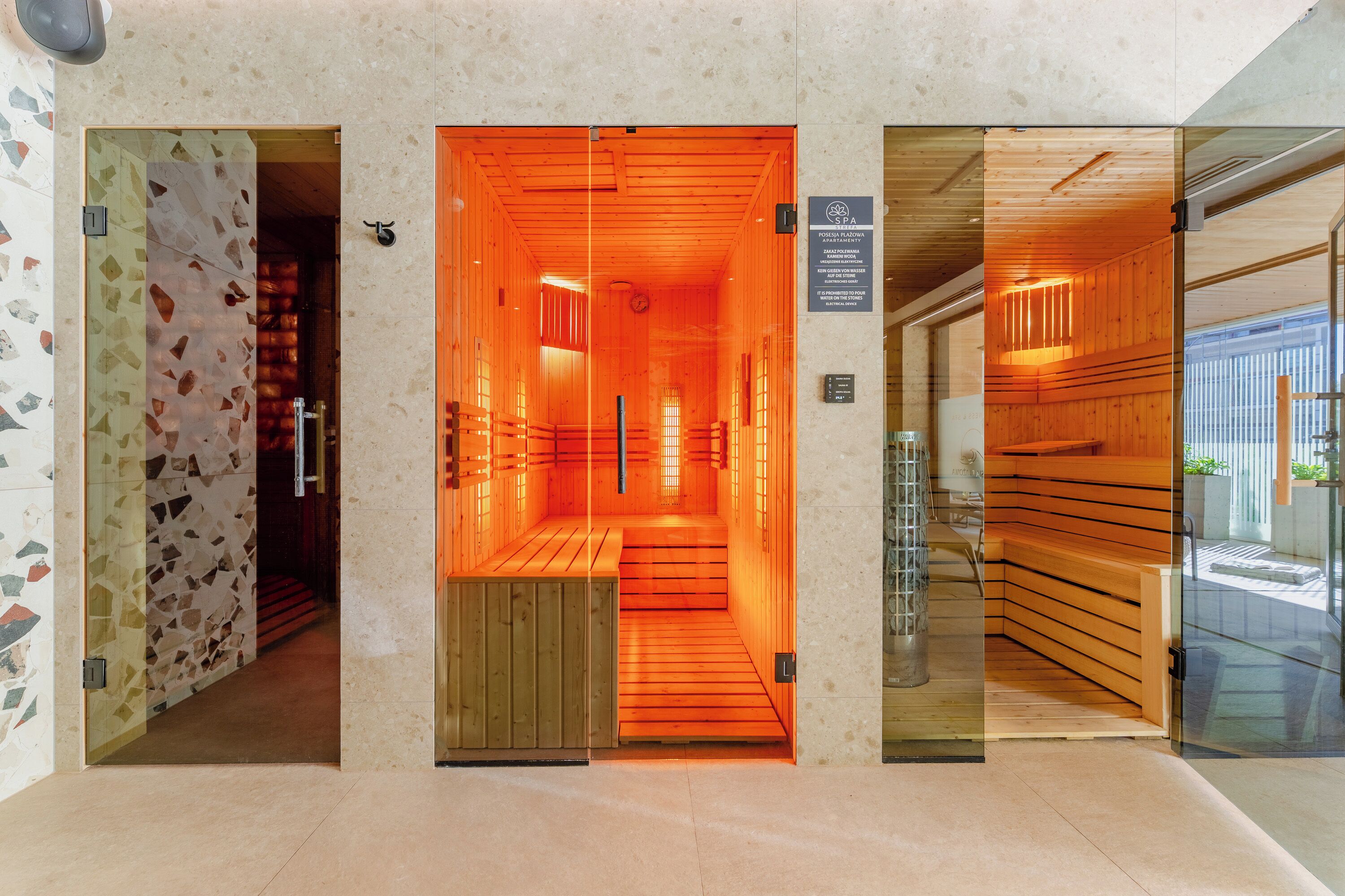 A spa entrance with a wooden interior and a sign indicating it is a sauna area.