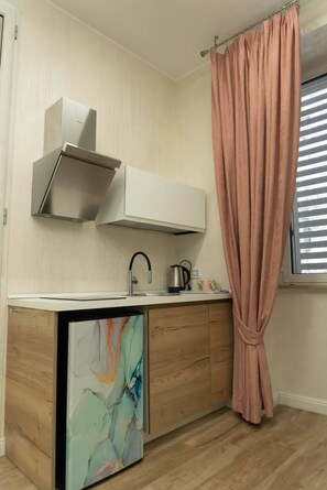 Chambre Triple Confort | Cuisine privée