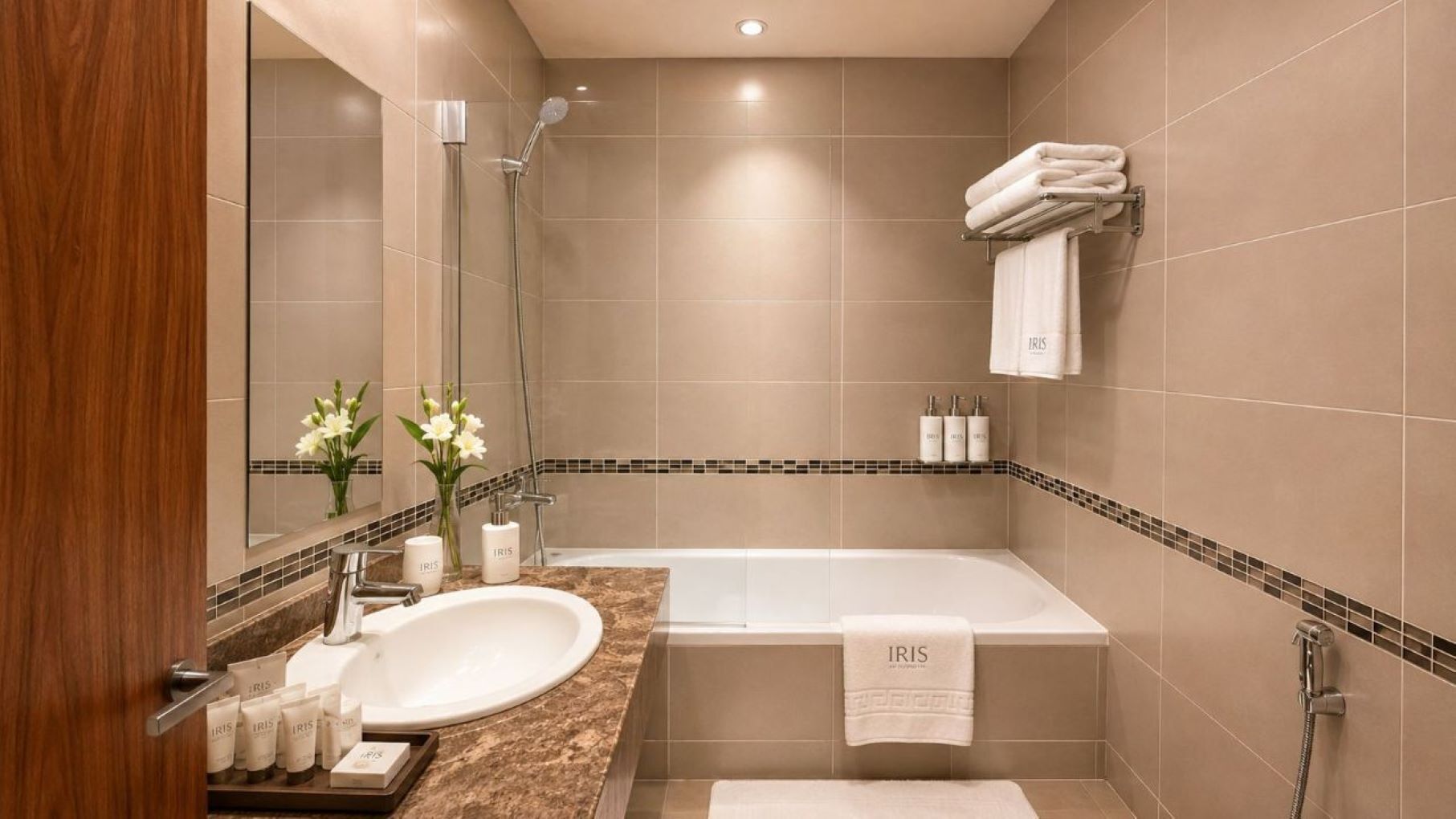 A modern bathroom with a bathtub, a sink, and a mirror.