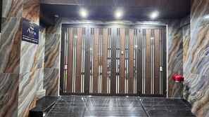 A modern elevator with a marble wall and a sign for 'Airy Stay' on the left. - Aira Cu Loc Apartment  (Hanoi)