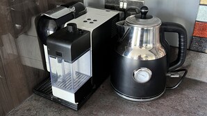 A coffee machine and a kettle on a countertop. - Luxury Clifftop Beach House: Panoramic Sea Views, FREE Hot Tub & Games Room (Cayton Bay)