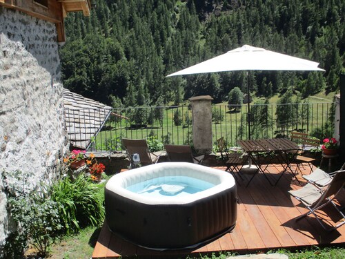 Baite del Baus—Baita d'là Cravià, a renovated old barn with a garden.