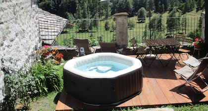 Baite del Baus—Baita d'là Cravià, a renovated old barn with a garden.