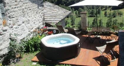 Baite del Baus—Baita d'là Cravià, a renovated old barn with a garden.