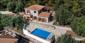 A two-story house with a swimming pool, surrounded by trees. - Villa Galatia - Three Bedroom Villa, Sleeps 6 (Perigiali)