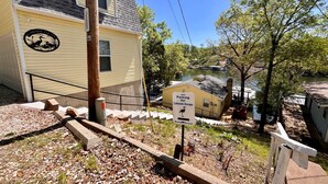 A lakeside building with a sign indicating parking for Lakeside Escape. - Lakeside Escape With Boat Slip (Rocky Mount)