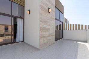 A modern building with large windows, a tiled floor, and a flat roof. - Vogue, Wadi Al Safa Villa The Fields Elie Saab (Wadi Al Safa)