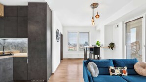 A modern apartment with a kitchen, dining area, and living room. - Design & Panoramic View - Central BA (Bratislava-Staré Mesto)
