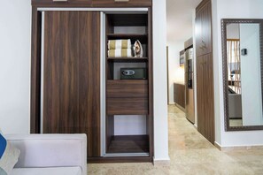 A modern kitchen with built-in appliances and a wooden cabinet. - Ground-Floor Studio · Terrace & Rooftop Pool (Playa del Carmen)