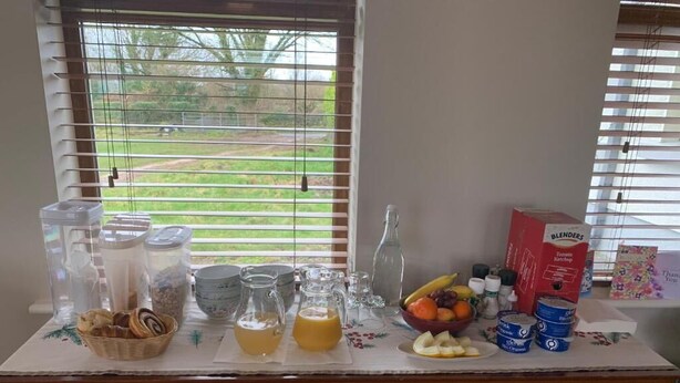 A kitchen counter with various food items and kitchenware. - St John s B and B (Lecarrow)