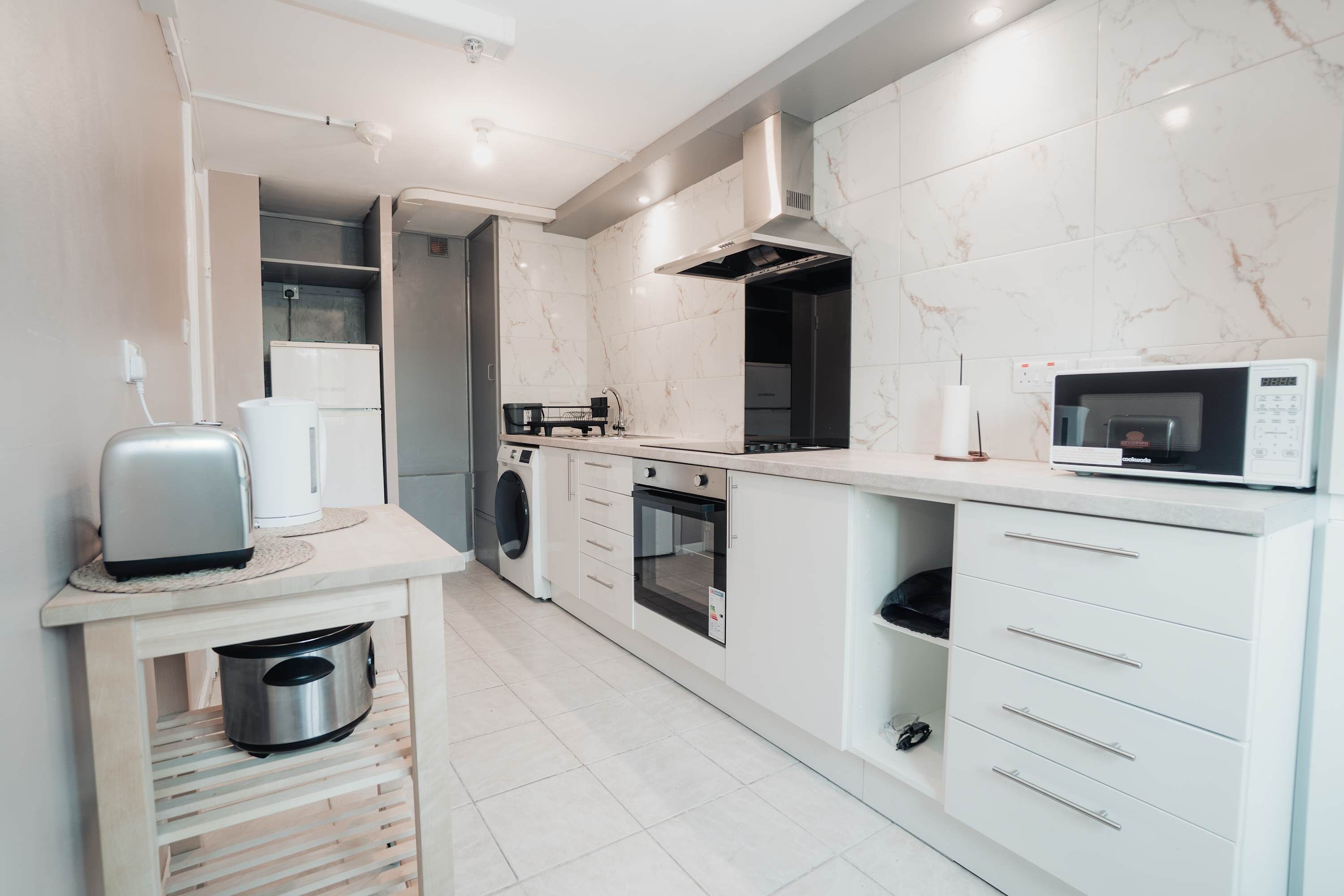Toaster, kettle, microwave, oven and hob, plus a Nespresso machine and coffee to go with it. Make breakfast in your pyjamas rather than queueing for a hotel buffet. Pots, pans, oil, salt and pepper all provided.