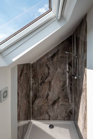 A skylight above a shower with marble walls. - Panoramic View by MyCityHaven (Redland)