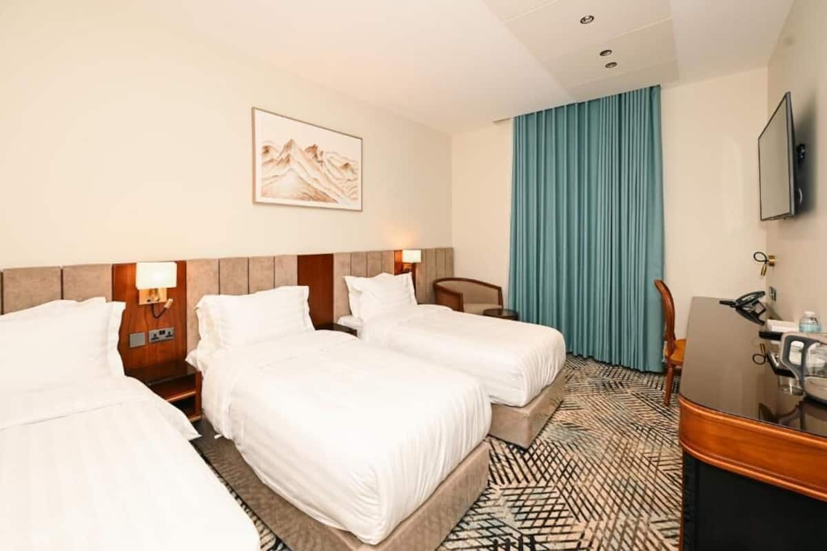 Chambre Triple Deluxe | Coffres-forts dans les chambres, chambres insonorisées