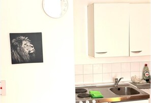 A kitchen with a sink, stove, and cabinets. - Ground Floor Studio - Willesden Green - Sleeps 4 (London)