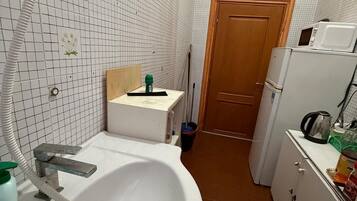 Mini-fridge, microwave, oven, stovetop