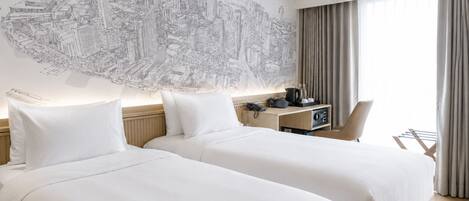 A hotel room with two beds, a cityscape mural, an air conditioning unit, a desk with a phone, and a chair.