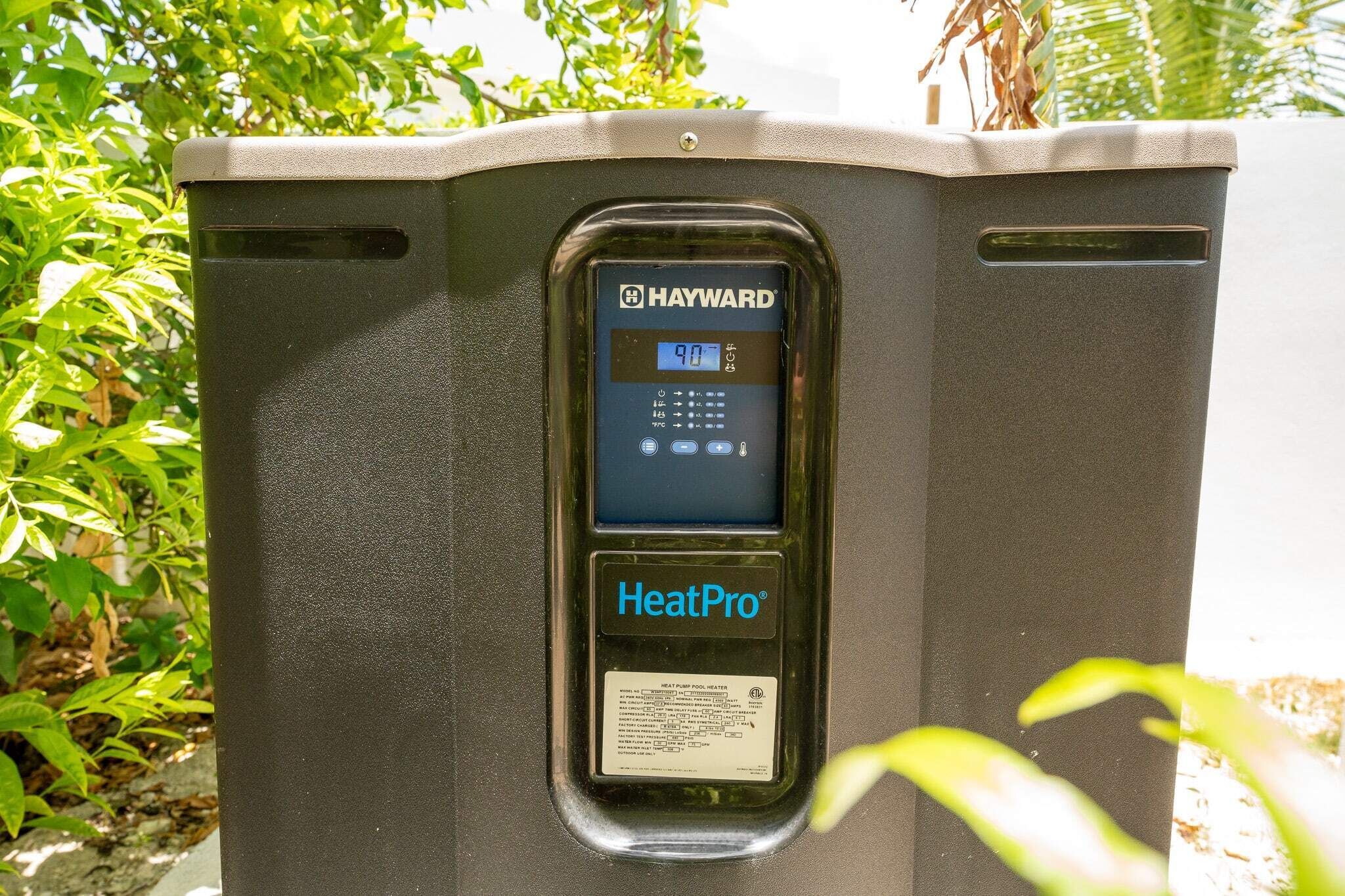 A black outdoor heater with a digital display and control panel, labeled 'Hayward HeatPro.'