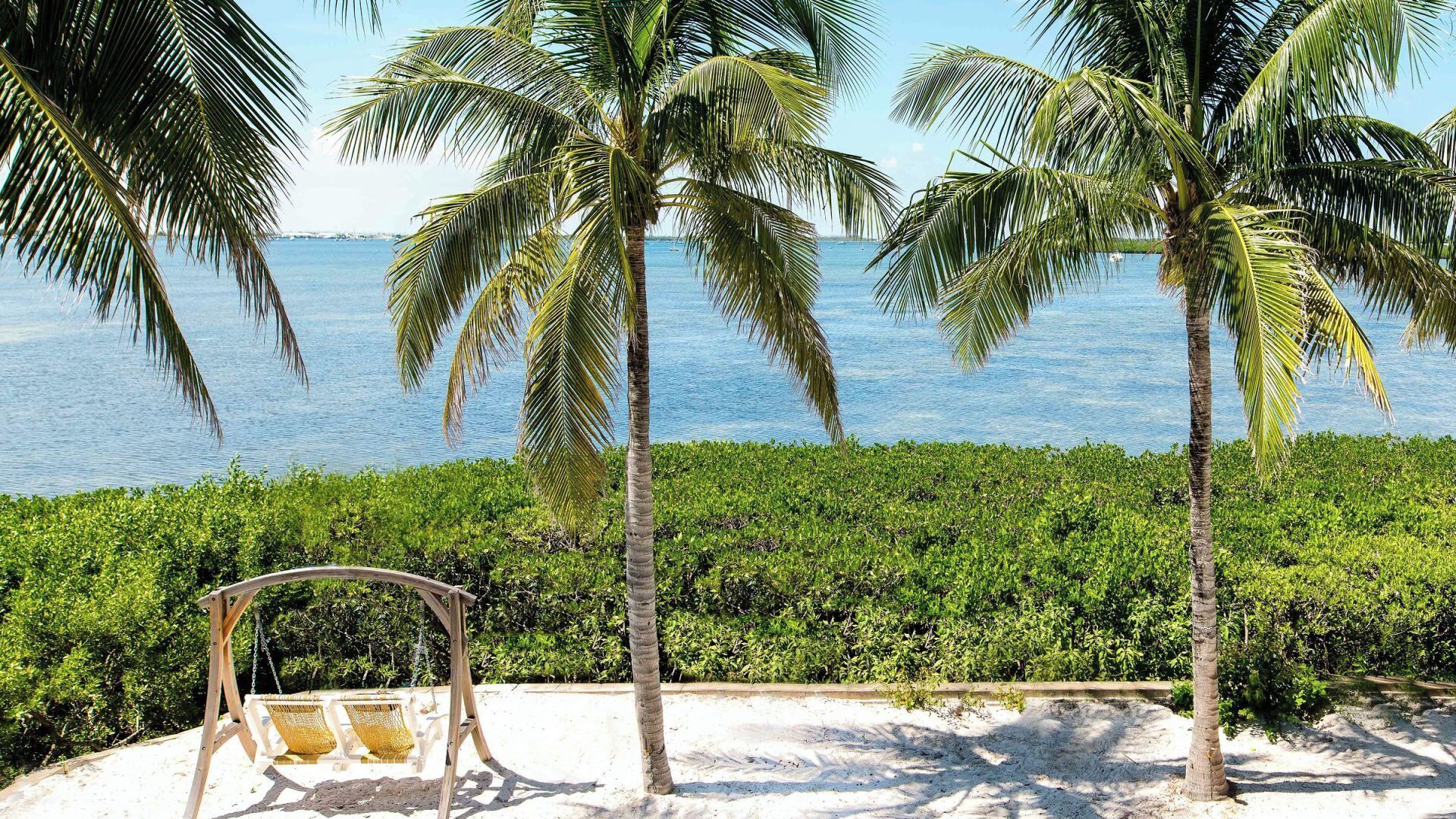 Wake up to sea breezes and swaying palms outside.