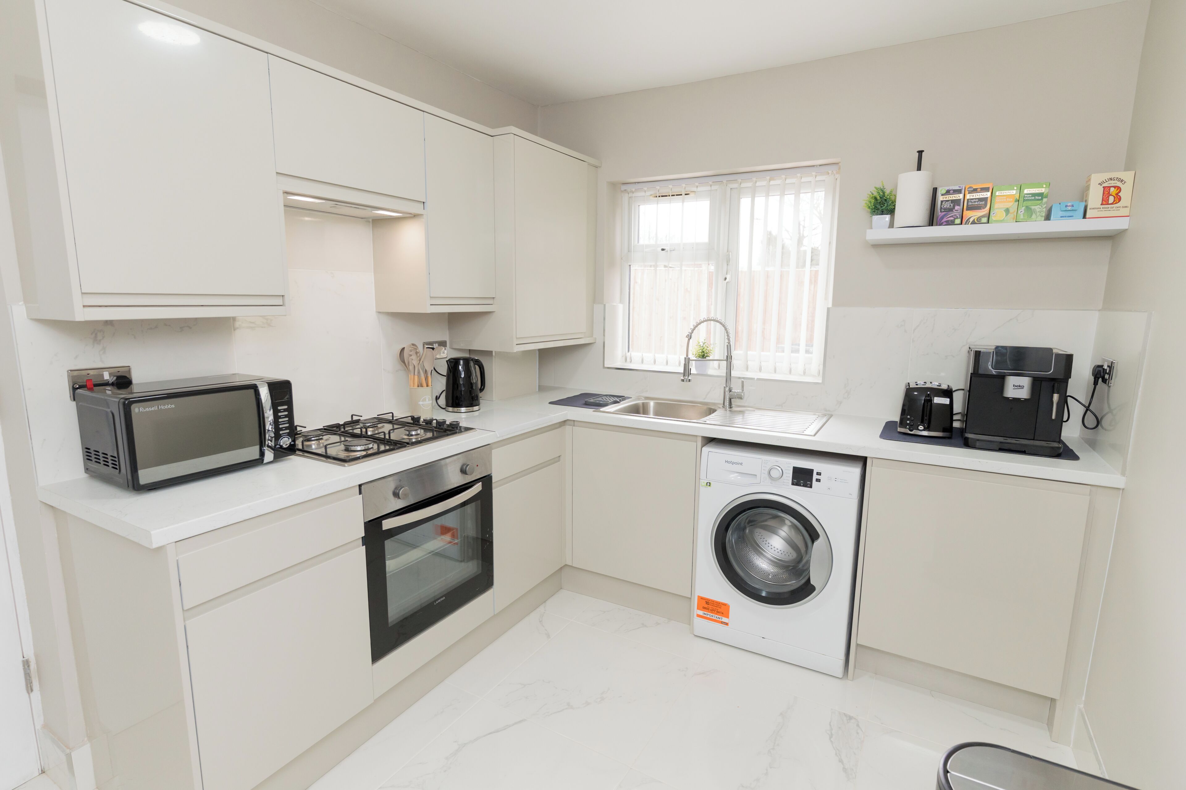 Coffee/tea maker, fridge, microwave, oven