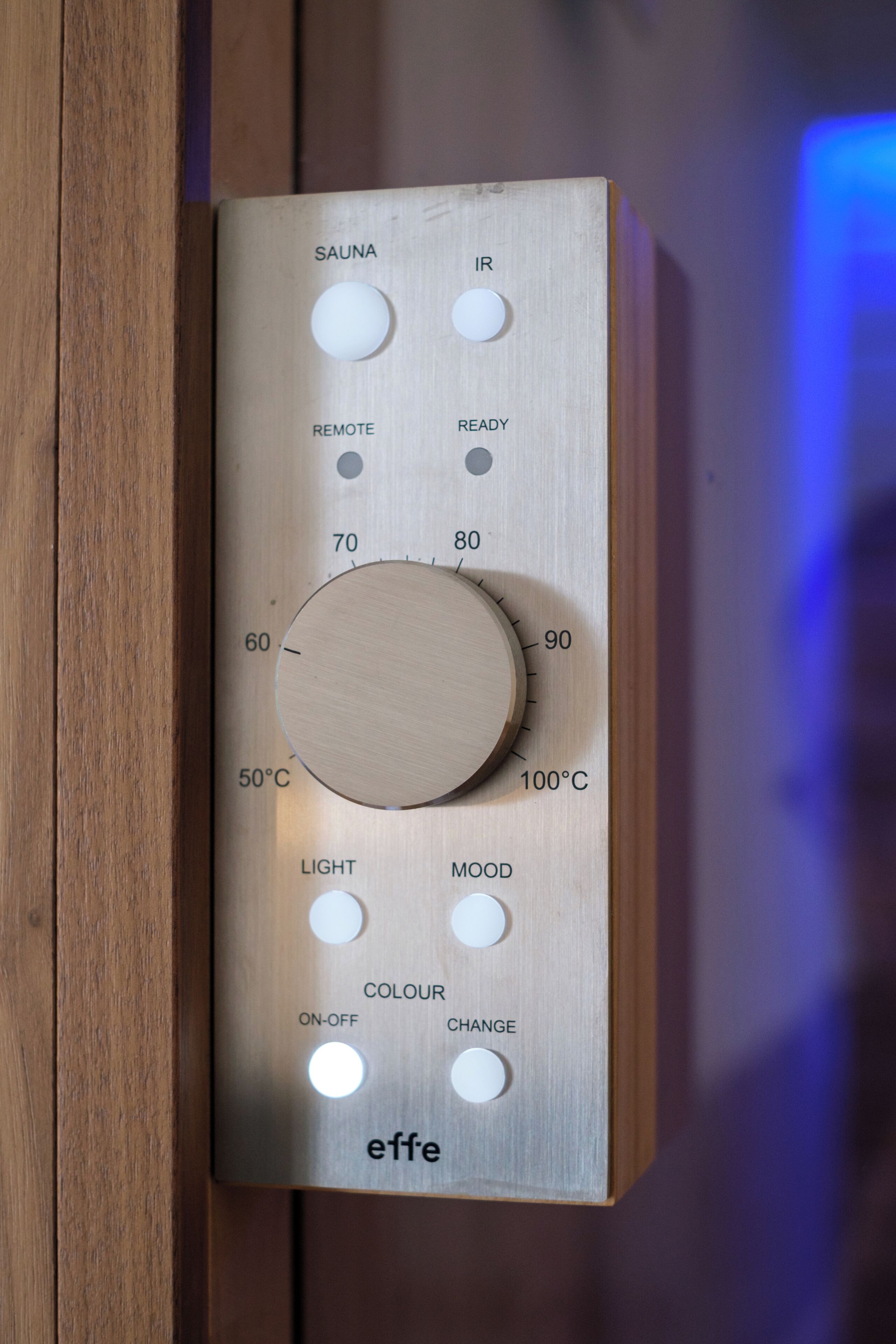 A control panel with temperature settings, remote control, and mood lighting options.