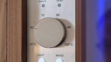 A control panel with temperature settings, remote control, and mood lighting options.