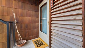A wooden exterior with a door marked '202' and a doormat with 'HAPPY HOME'. - Walk to Zilker & Barton Springs / Old Austin Charm / Private Patio & Parking (Austin)