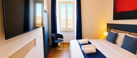 Habitación Deluxe, vista a la ciudad | Wifi gratis
