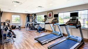 A gym with treadmills, elliptical machines, and free weights. - Accessible 1BR Suite w/ Kitchen + Free Breakfast (Davie)