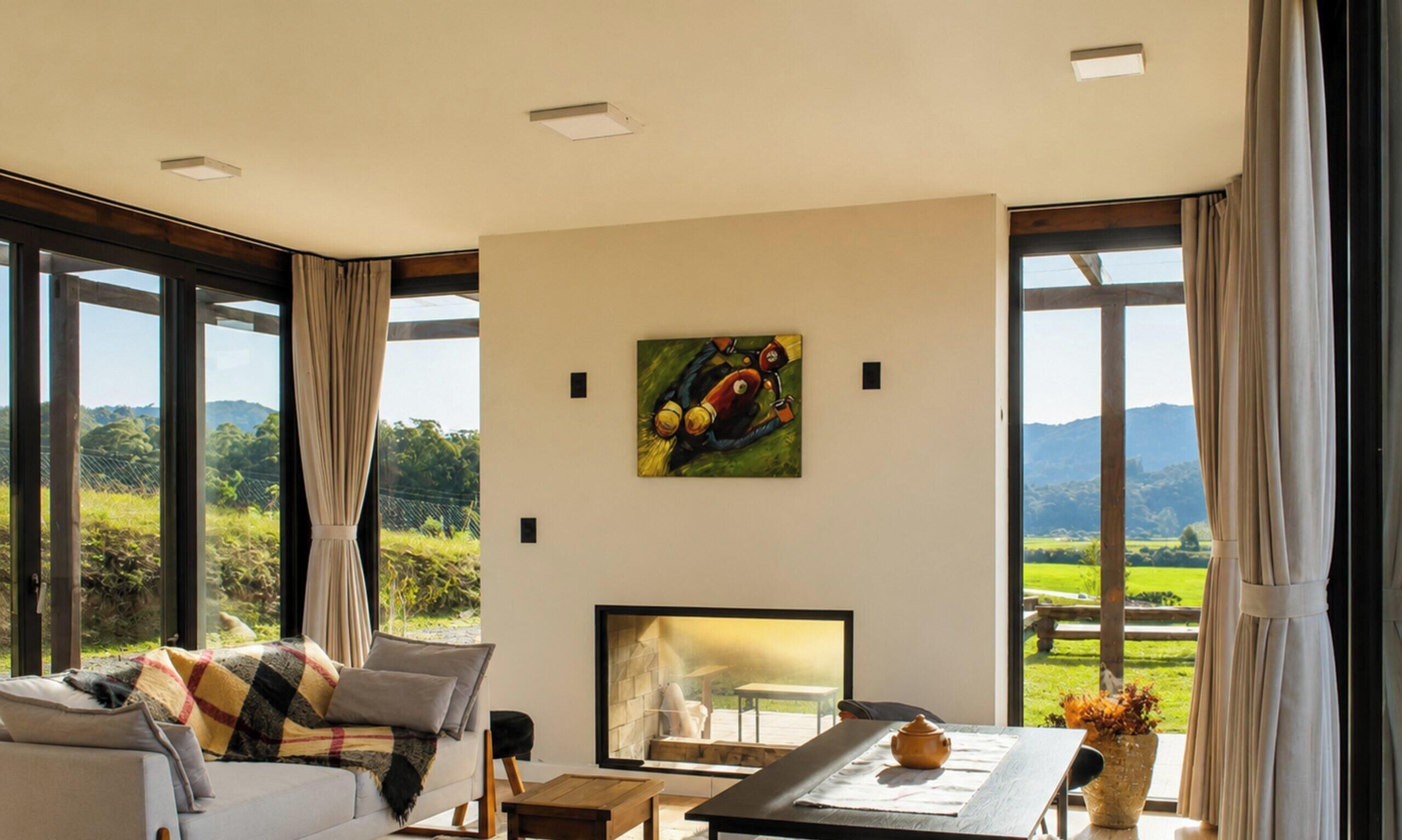 A modern living room with a sofa, a coffee table, and a painting on the wall.
