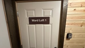 A door with a sign reading 'Ward Loft 1' and a keypad lock. - Ward Loft 1 (Fireplace, King Bed, Smart TV) (Canton)