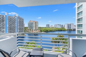 A balcony with a view of a river and cityscape, including high-rise buildings and a marina. - Atlantic Ocean Sunrise Suite Unit 820 (Fort Lauderdale)