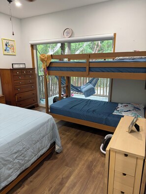 A bedroom with a bunk bed, a desk, a dresser, and a hammock. - Spacious 2 bedroom house in fabulous Key Largo with AC. Mile 100 1/2 from US1 (Key Largo)