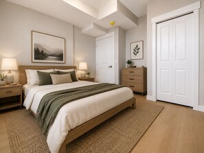 A bedroom with a bed, nightstands, a dresser, a door, and a ceiling light. - Mahogany Lake Hideaway Cozy 2BR Suite (Calgary)