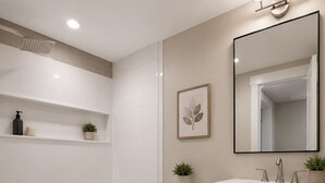 Ein modernes Badezimmer mit Badewanne, Toilette und Waschtisch.