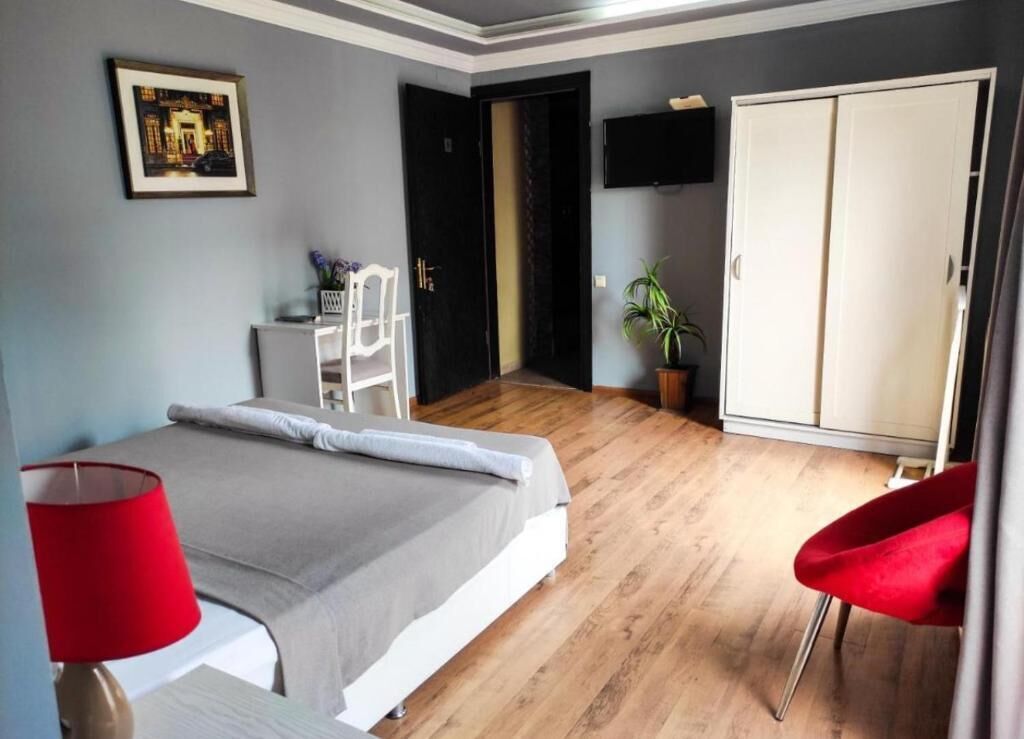 Suite, Balcony, City View | Desk, laptop workspace, iron/ironing board (on request), free WiFi