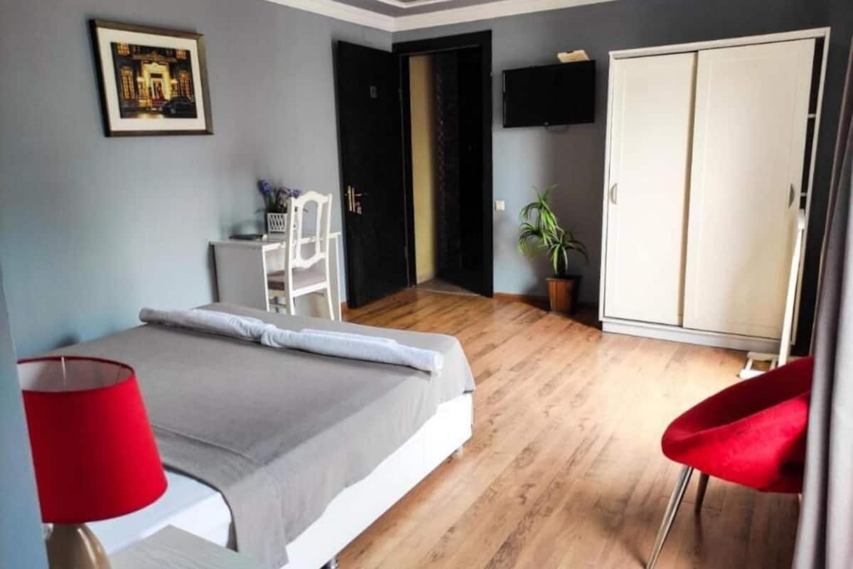 Suite, Balcony, City View | Desk, laptop workspace, iron/ironing board (on request), free WiFi