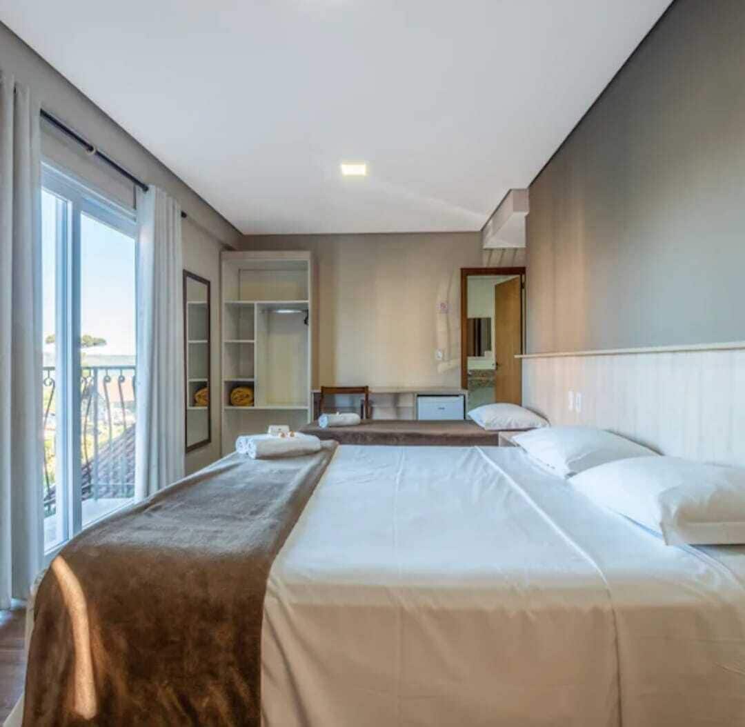 Double Room, Balcony, City View | Blackout drapes, iron/ironing board (on request), WiFi (free)
